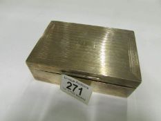 A silver cigarette box, hallmarked Birmi