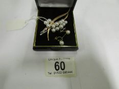 A 1970's pearl set spray 14ct gold brooc