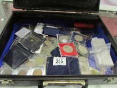 A briefcase of UK and foreign coins incl