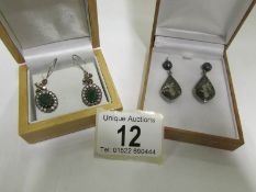 2 pairs of silver set pendant earrings,