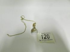 A 18ct gold topped 'Bottle of Gold' pend