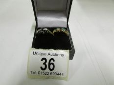 An 18ct gold 3 stone sapphire and diamon