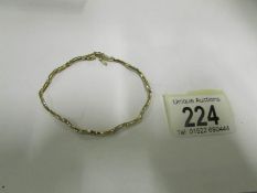 A 9ct gold and diamond bracelet, 5gms