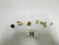 4 assorted 9ct gold charms, a 9ct gold b