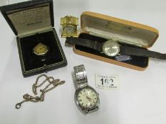 3 watches and a miniature clock