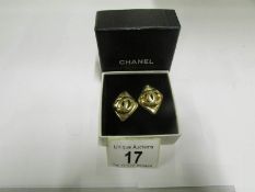 A pair of boxed original Chanel earrings