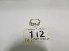 A 5 stone 9ct yellow gold ring, size N