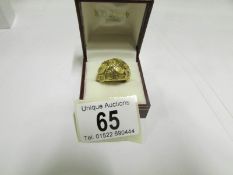 A textured ring dated 1971 in 9ct gold i