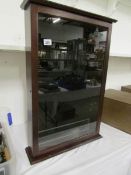 A jewellers wall display cabinet