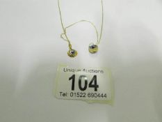2 18ct greek eye pendants on a 9ct gold