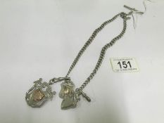 A silver double Albert watch chain and 3