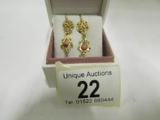 A pair of 18ct gold pendant earrings set