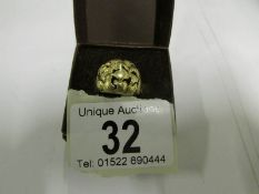 An 18ct gold ring in a knot design, HM B