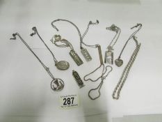 A mixed lot of silver pendants and chain