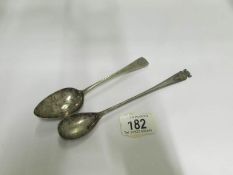 A silver spoon and a Lincoln Imp spoon