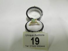 An Australian natural opal ring set in 9