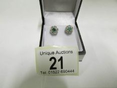 A pair of gold set diamond and emerald s