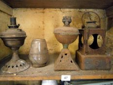 A quantity of old oil lamp bases etc.