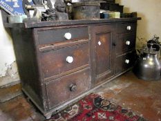 A pine 6 drawer cabinet with central cup