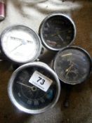 A Stewart speedometer & 3 car clocks