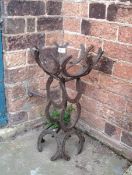 An unusual horse shoe plant stand
