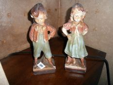 A pair of plaster figures