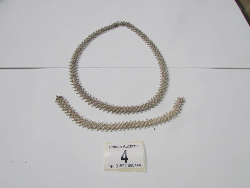 A Persian silver necklace and bracelet