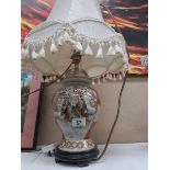 An Oriental style table lamp with shade