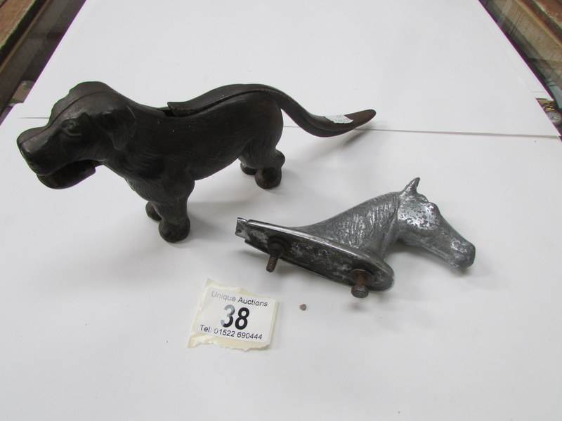 A dog nutcracker and a horse head car ma