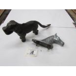 A dog nutcracker and a horse head car ma