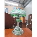 A cut glass table lamp with overlaid gre