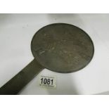 A signed Chinese bronze hand mirror