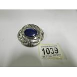 A large silver Celtic brooch set lapis l