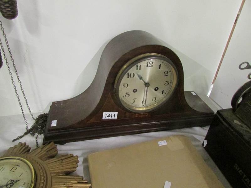 A mahogany inlaid mantel clock (key and