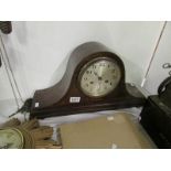 A mahogany inlaid mantel clock (key and