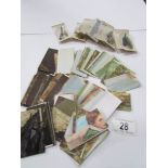 A small tin of cigarette cards including