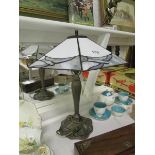 A spelter table lamp with Tiffany style