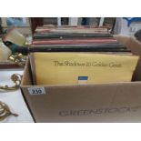 A box of LP records including Metallica,