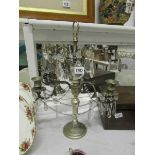 An ornate brass and crystal candelabra