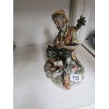 A Capo di Monte style poacher figure