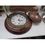 A brass 'porthole' clock and a copper fo