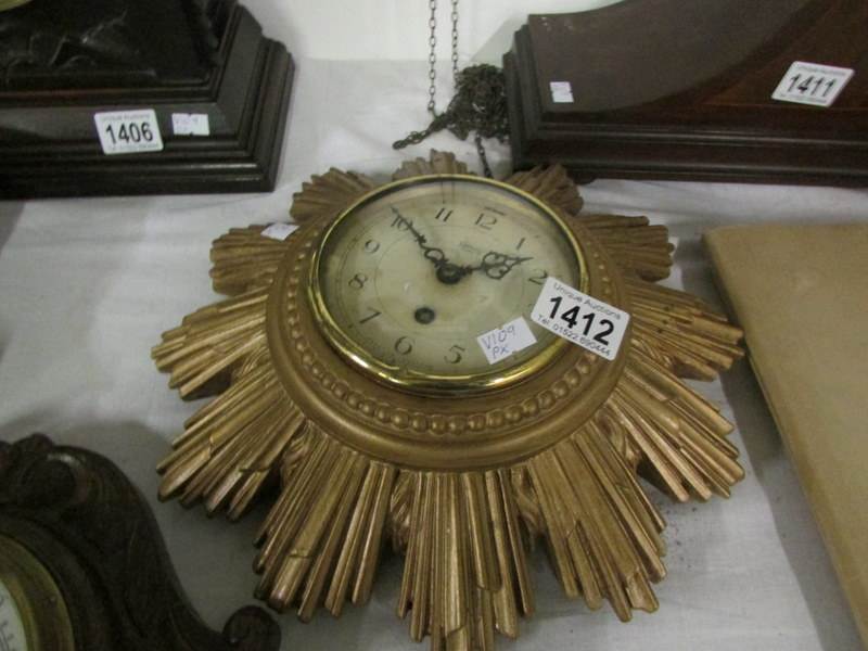 A sunburst clock (key in office)