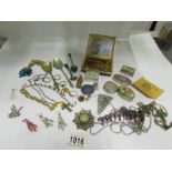 A mixed lot including earrings, pill box