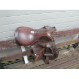 A horse saddle with stirrups