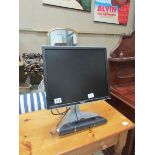 A Dell computer monitor with speakers