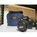 A Nikon D100 camera with case