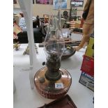 A Victorian glass oil lamp with chimney