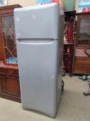 A silver coloured Indesit fridge freezer