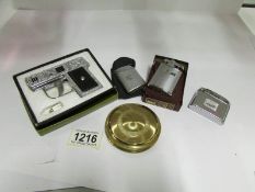 A powder compact and 4 cigarette lighter