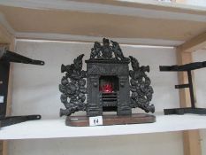 A miniature cast iron fire place and 2 m